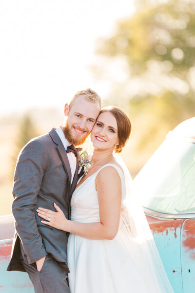 beautiful sunset image of  bride and groom on wedding day at lock stock and barrel