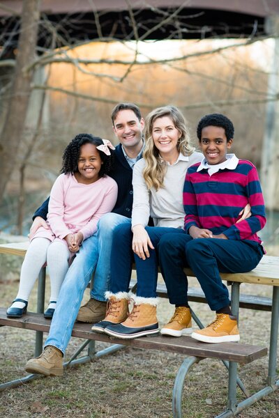Family photo sitting on picnic table