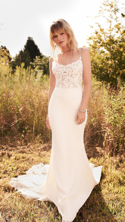 bride wearing a fitted wedding dress with a scoop neckline