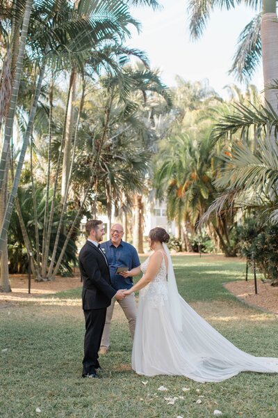 A tropical elopement at Gizella Kopsick Palm Arboretum in St. Pete, surrounded by exotic palm species and serene pathways.