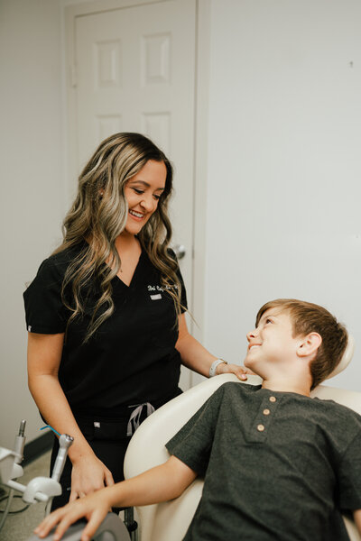 Dental assistant and patient