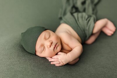 Baby boy in all green for newborn photograph