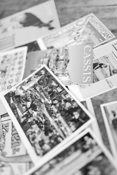 Pile of postcards, including one with the word "Cassis