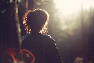 woman facing the sunshine