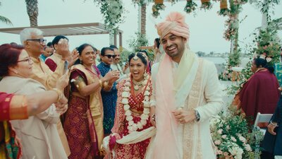 Indian wedding couple laughing