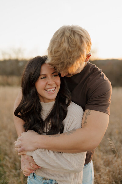 the groom celebrates with his groomsmen at his wisconsin wedding