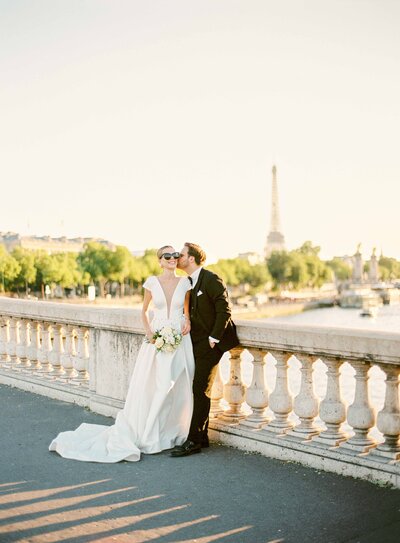 a couple laughing at pont alexandre 3