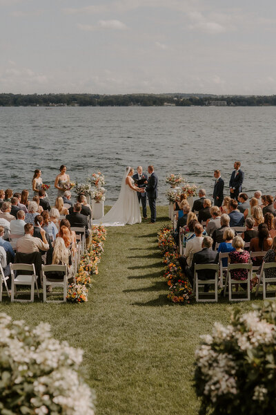 couple standing in desert by cactus