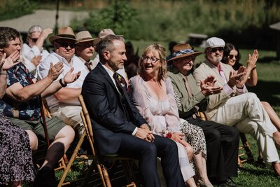 Wedding guests sitting at wedding ceremony