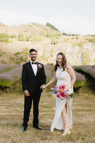 grrom-in-tux-&-bride-with-florals