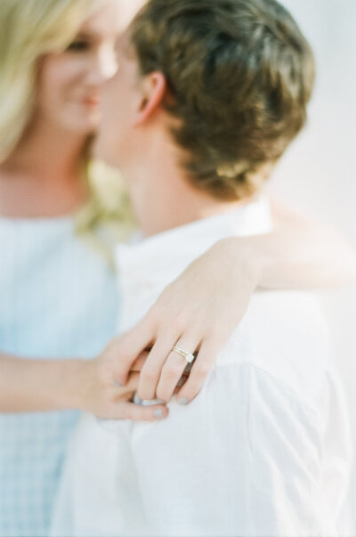 couple hugging, wedding ring, Charleston engagement session, Renee Lemaire Photography
