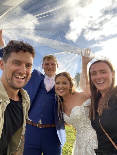 Amy & Nick posing with couple