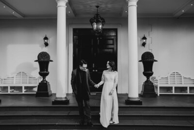 Documentary Wedding Photographer in Melbourne captures couple walking down the stairs of Ivory Elsternwick for their wedding portrait session