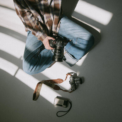 Green camera bag hanging in boise photographers' home office