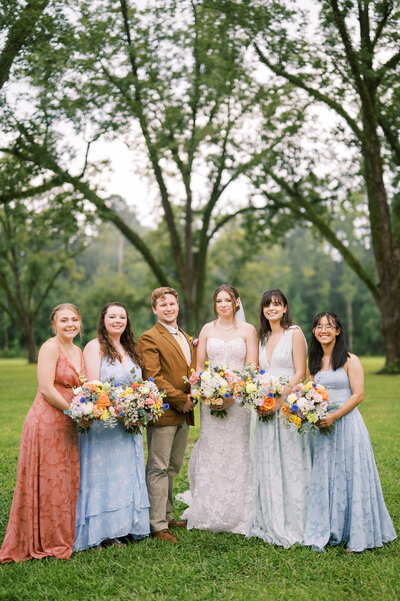 Bridal party portrait under beautiful oak trees