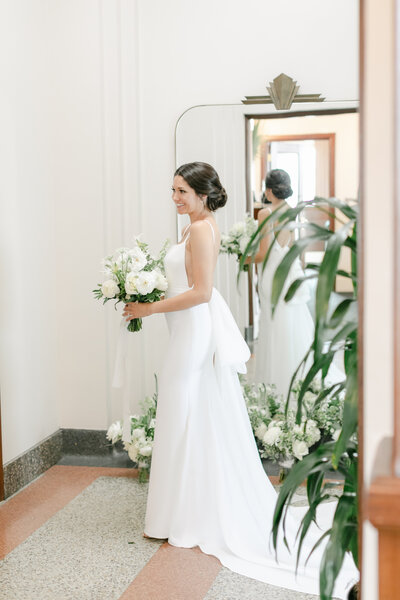 Bride and groom walk up memorial steps at their DC wedding