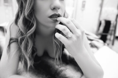 black-white-portrait-woman-finger-to-lips-wedding-ring-boudoir