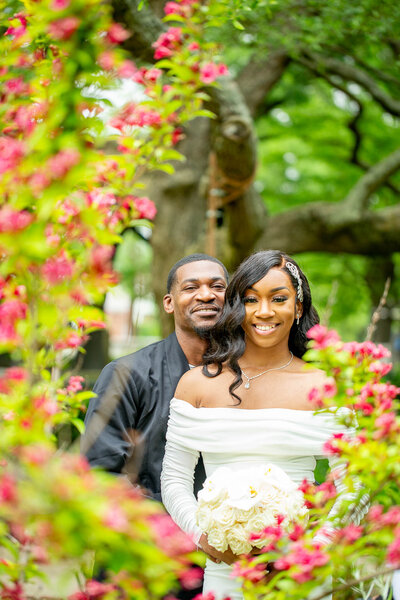 This elegant Black couple stands side by side after their elopement, framed by the lush gardens of the Hampton-Preston Estates. A timeless portrait of love, style, and commitment.