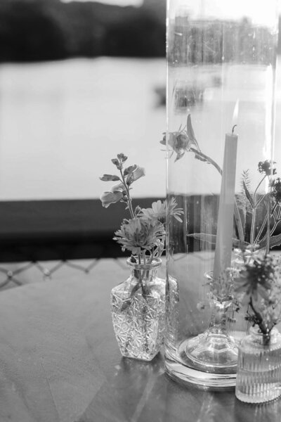 Candle and flowers designed by love nest events.