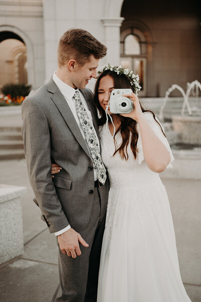 bride showing off her snow boots under her wedding dress