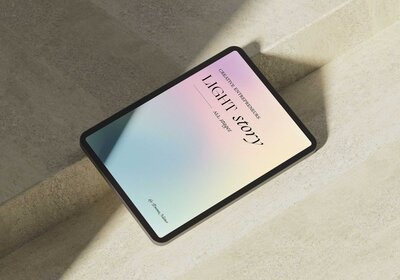 mockup of a tablet device showcasing the light story on a stone background