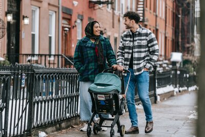 Young couple walking together with baby
