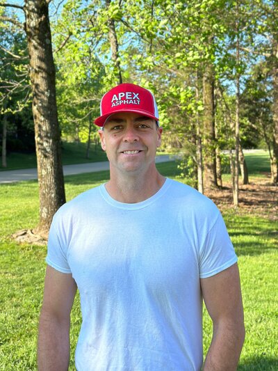Smiling man with a red hat and white tshirt