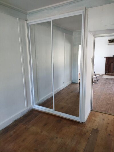 Sliding wardrobe doors with a sleek design, offering practical and aesthetic solutions for modern bedrooms.