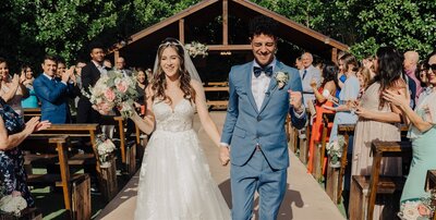 bride and groom walking down aisle florida wedding