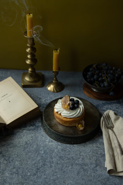 Fall inspired cake with candles and book.