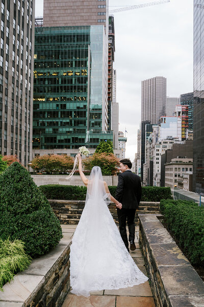 Bride cheering at top New York wedding venue 620 Loft and Garden