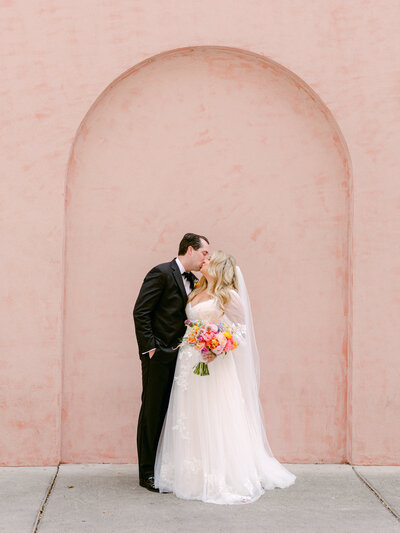 Couple Kissing Pink House Savannah, GA Wedding