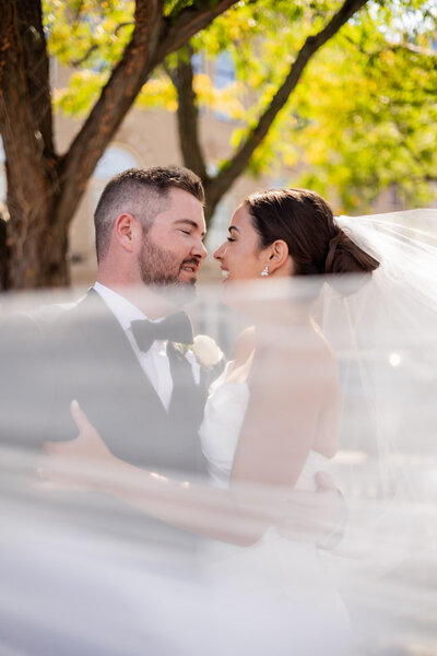 Explore the vibrant energy and romantic moments of Mary Grace and Martin's engagement shoot set against the bustling backdrop of New York City. This captivating image showcases the couple's love as they stroll through the iconic streets, with skyscrapers and city lights adding a dramatic flair to their tender moments. Ideal for couples seeking inspiration for their own engagement photos, this shoot exemplifies how New York City's dynamic urban landscape can serve as the perfect canvas for celebrating love.