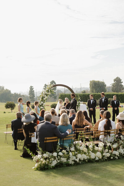Couple kissing with bubbles being blown in the background