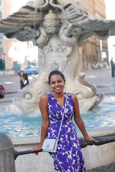 Pooja V. life Coach in frotn of a fountain in New York City