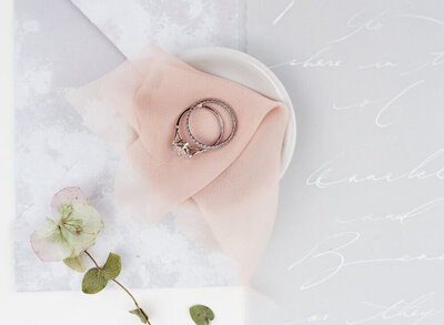 Wedding rings set on a blush ribbon at New York wedding