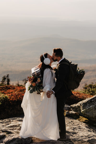 Bride and groom hiking Mount Mansfield for Vermont elopement
