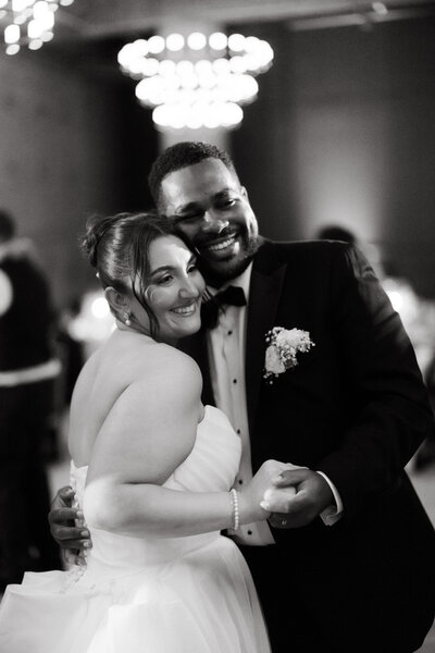 A girl walking through Musser park with her fiance during golden hour. She is walking on a ledge and he is holding her hand. Taken on 35 mm film. 