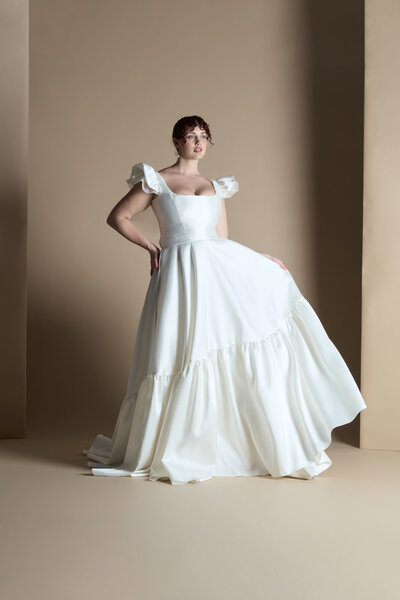 black and white image bride wearing feathered wedding dress