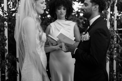 new bride and groom signing marriage license after ceremony at hotel vacancy courtyard elopement in kc