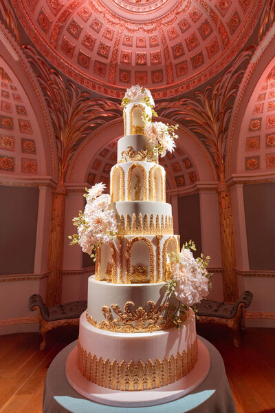 front page of 5 star wedding directory publication featuring work by westacott weddings and events and showing a closeup of of a seven tier luxury wedding cake