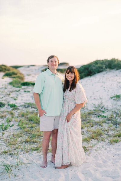 Josie kitch posing with husband on the beach