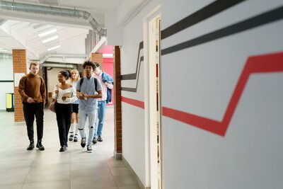 Students walking through hallway
