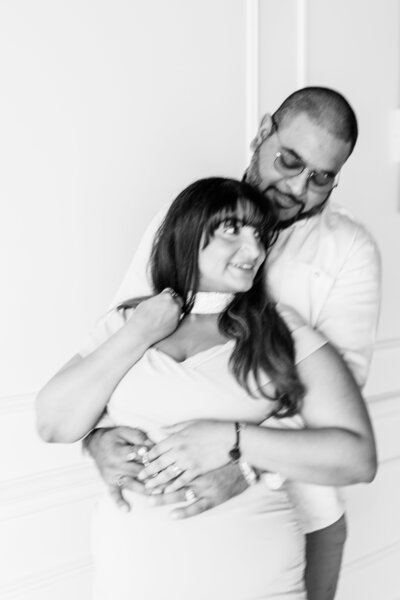 Mairead snuggles into her future husband as he rests his nose on her forehead during their engagement session in Windsor Ontario