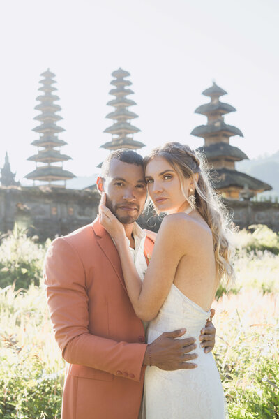 couple share a moment by the ocean before they elope in Bali