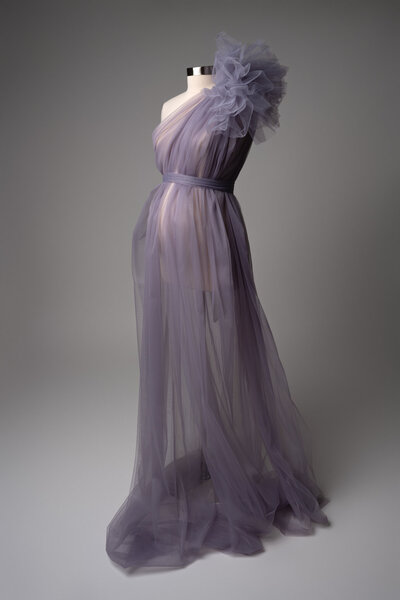 Lavender tulle maternity dress with oversized shoulder flower and sheer draping