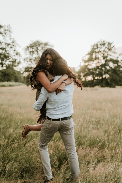 man twirling woman