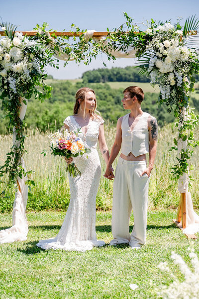Bride and groom posing at an outdoor wedding ceremony