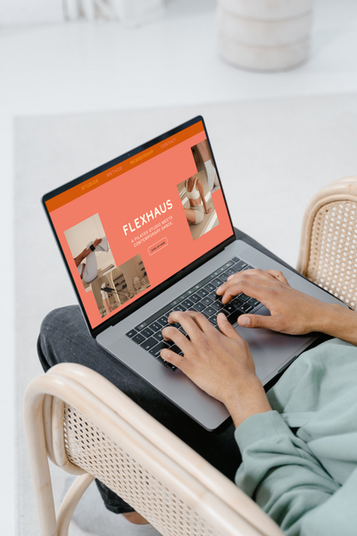 laptop displaying Flexhaus Pilates website