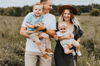 Parents with kids in open field